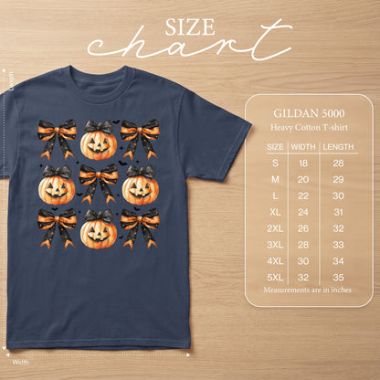 Navy t-shirt with a pattern of pumpkins and bows and a Gildan 5000 size chart.