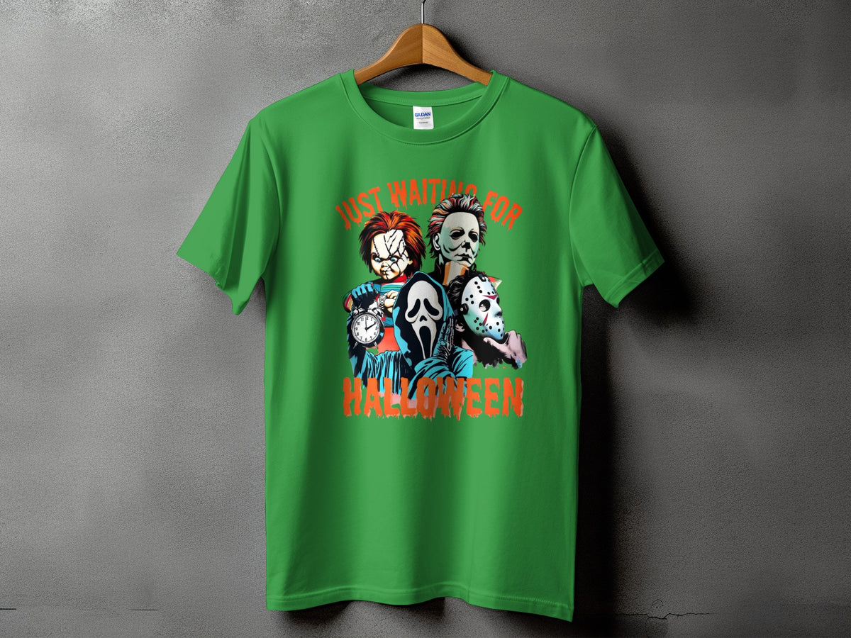 Green t-shirt with Chucky, Michael Myers, Ghostface, and Jason Voorhees, saying "Just Waiting for Halloween."