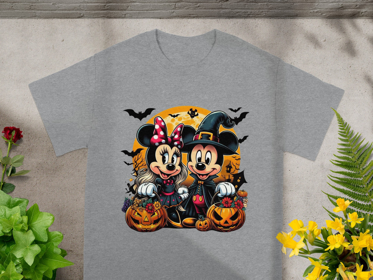 Mickey and Minnie Mouse in Halloween costumes holding jack-o'-lanterns.