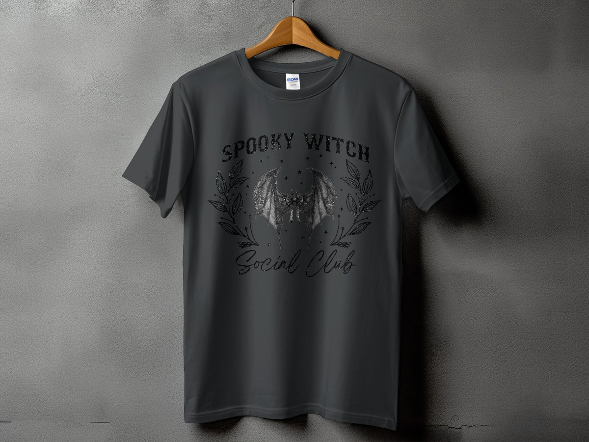 Dark grey t-shirt with "Spooky Witch Social Club" text and bat graphic.
