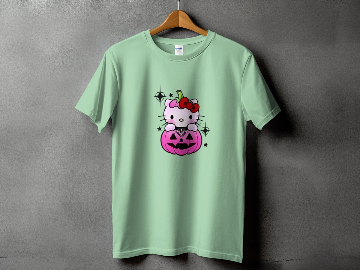 Light green t-shirt with Hello Kitty sitting in a pink pumpkin with a red bow.