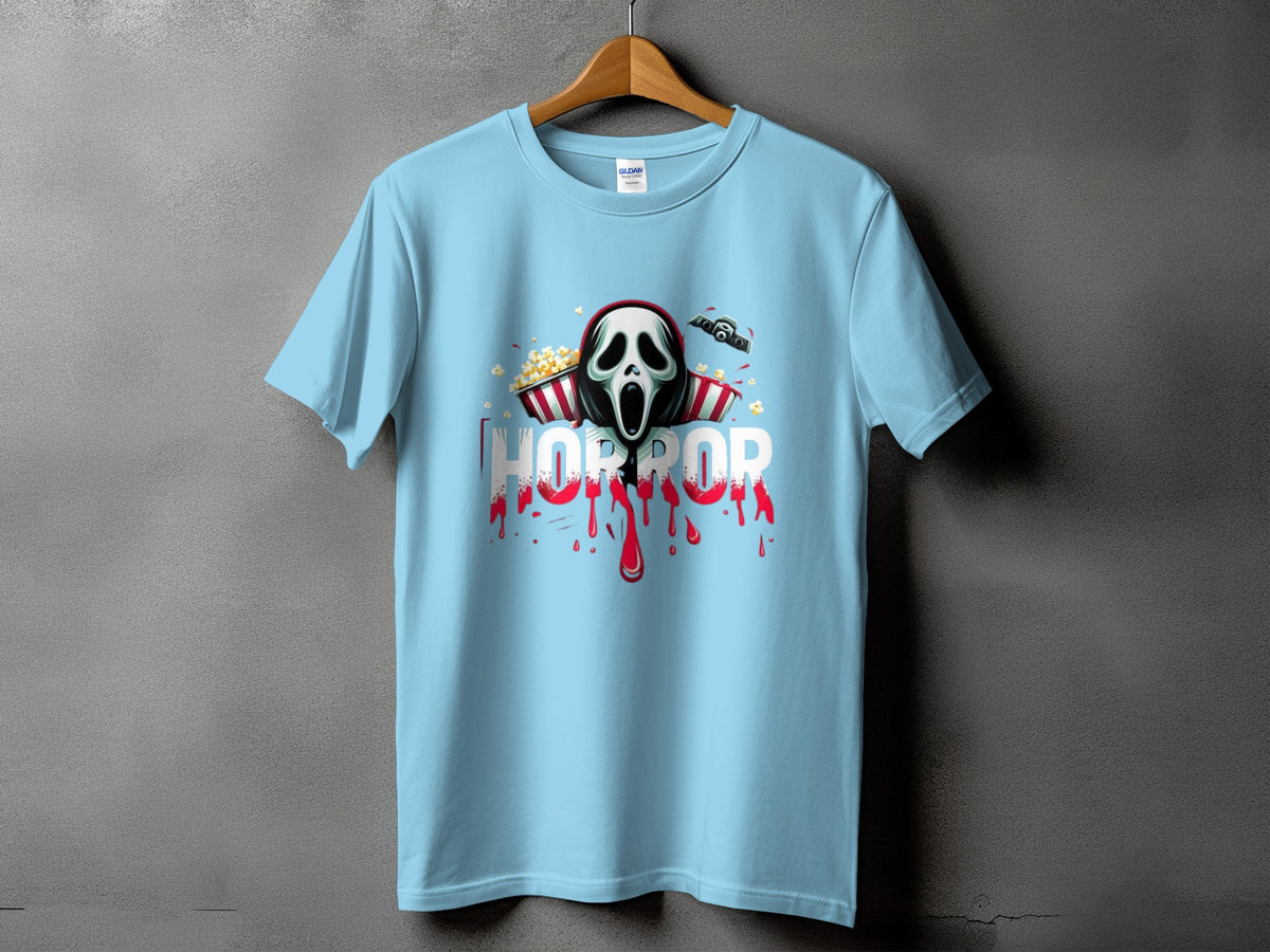 Light blue t-shirt with a horror mask, popcorn, and blood splatter graphic.