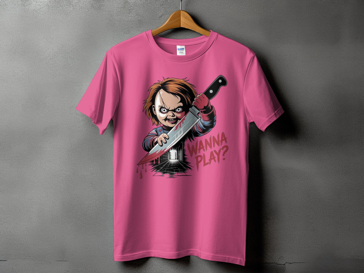 Chucky doll holding a knife with "Wanna Play?" text on a pink t-shirt.