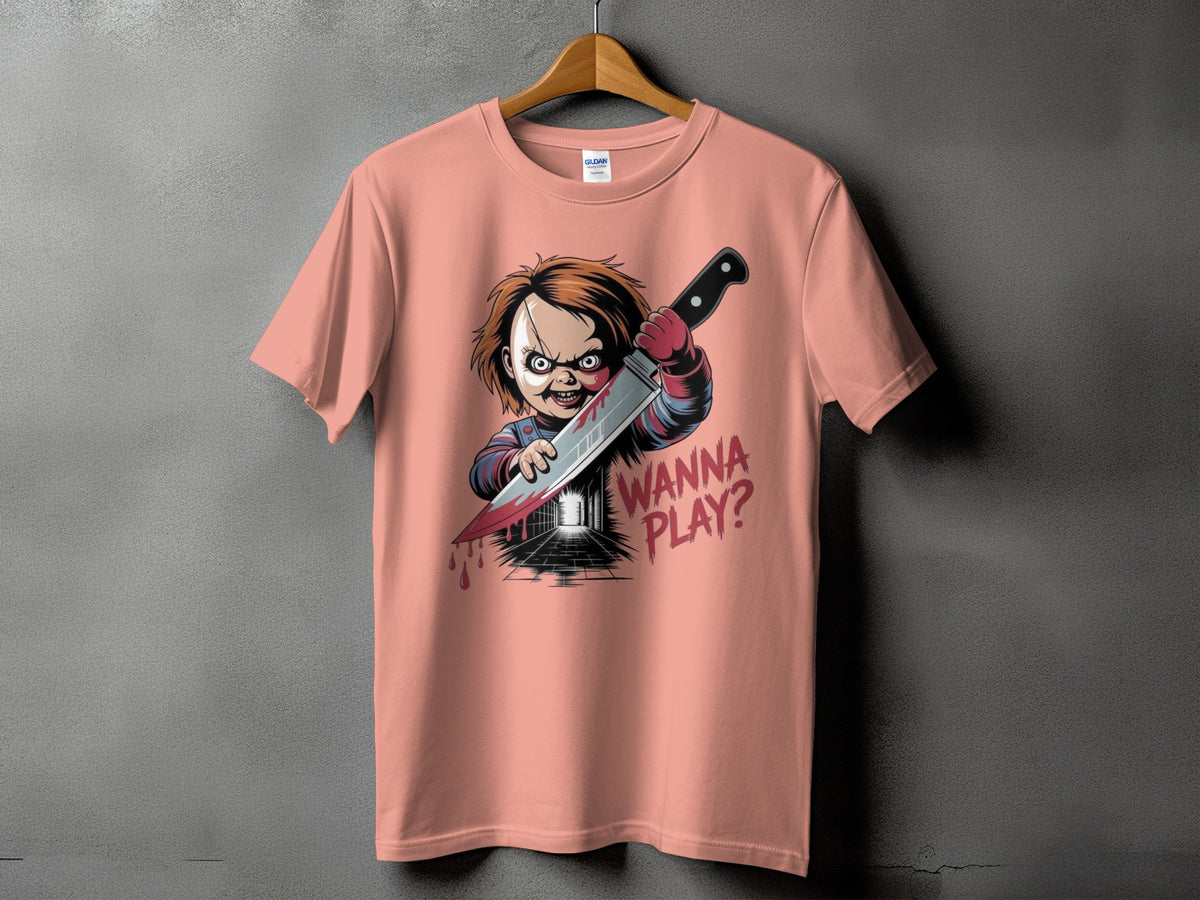 Coral t-shirt with Chucky holding a bloody knife and text "WANNA PLAY?".
