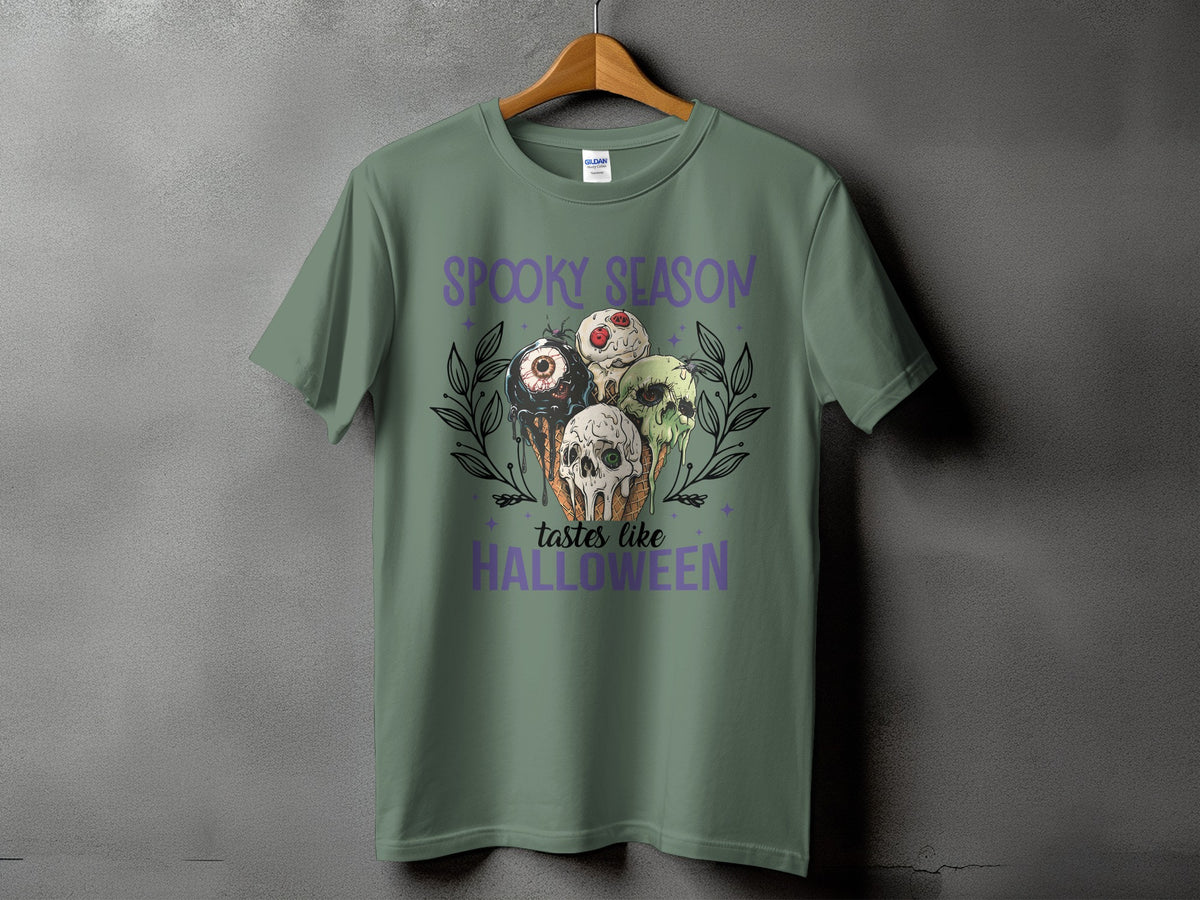 Green t-shirt with "Spooky Season Tastes Like Halloween" and Halloween ice cream graphic.