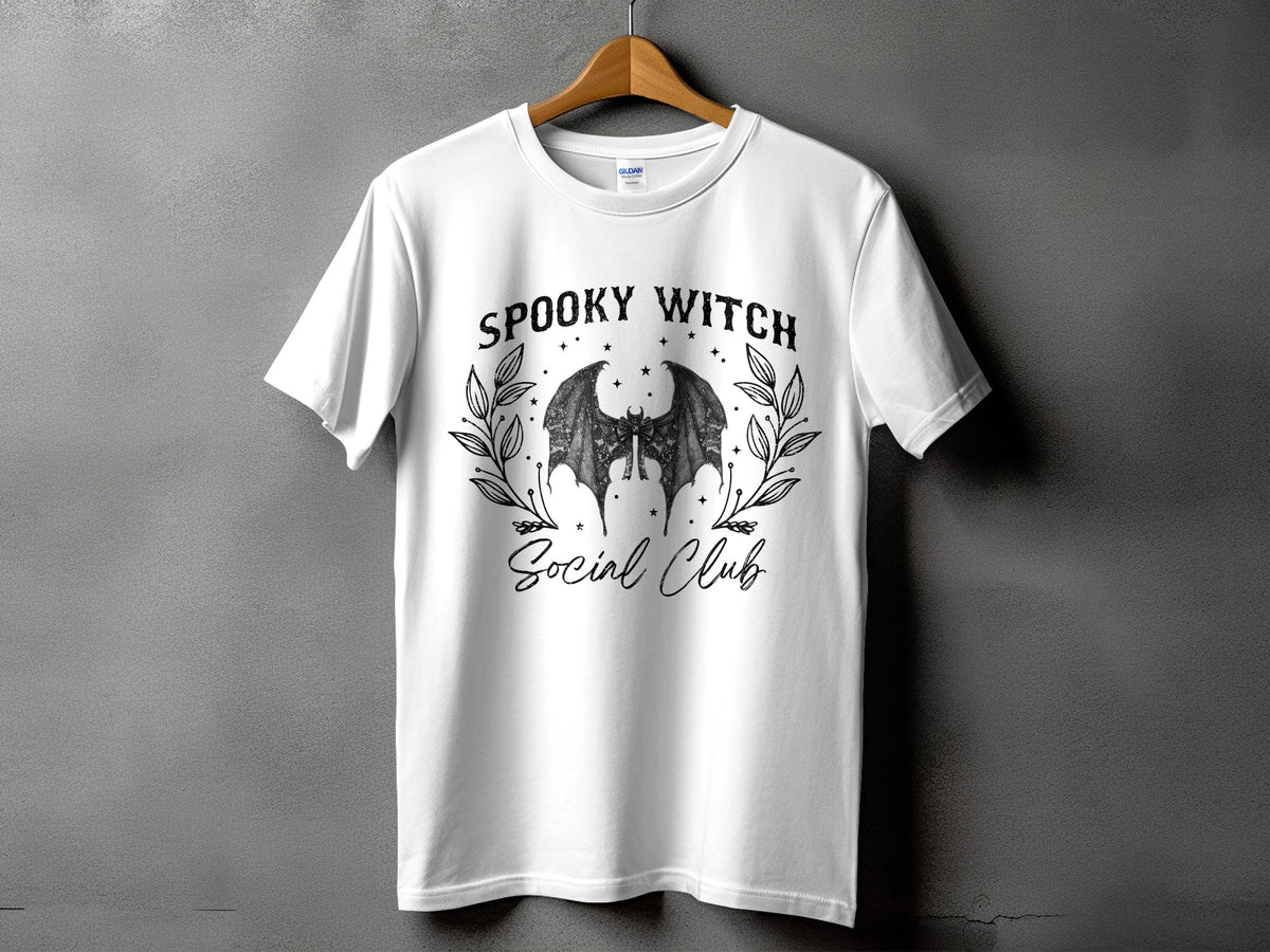 White t-shirt with "Spooky Witch Social Club" text and bat wings graphic.