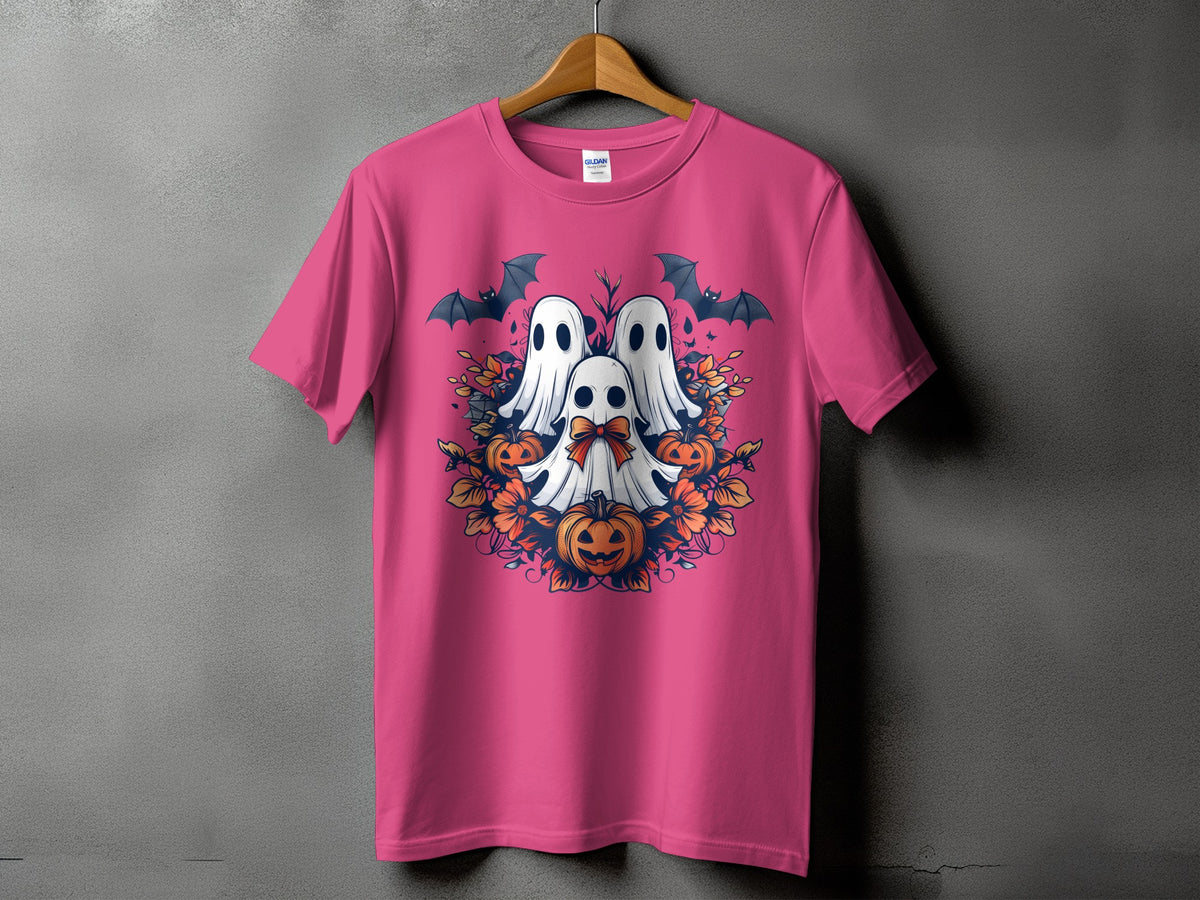 Pink t-shirt with a Halloween graphic of ghosts, pumpkins, bats, and autumn leaves.