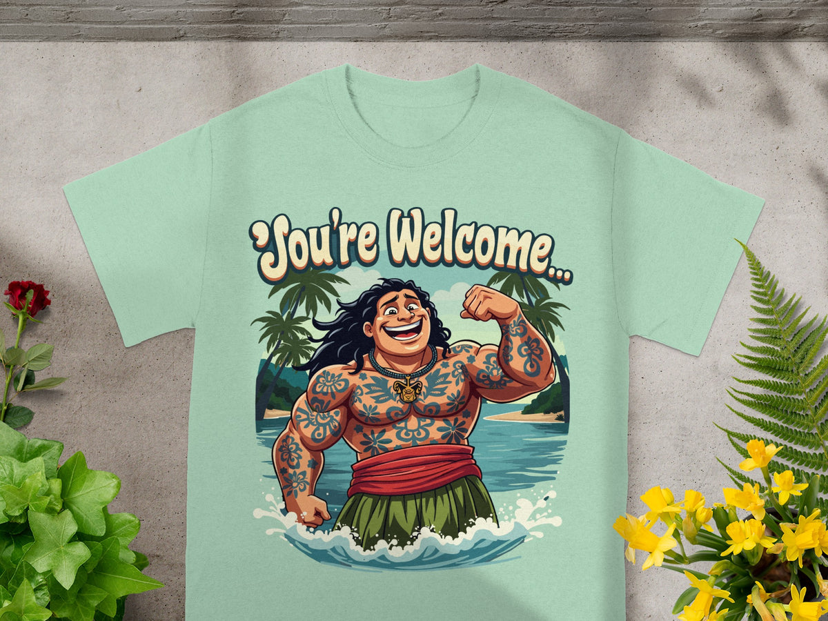 Mint green t-shirt with cartoon man flexing, "You're Welcome" text, and tropical background.
