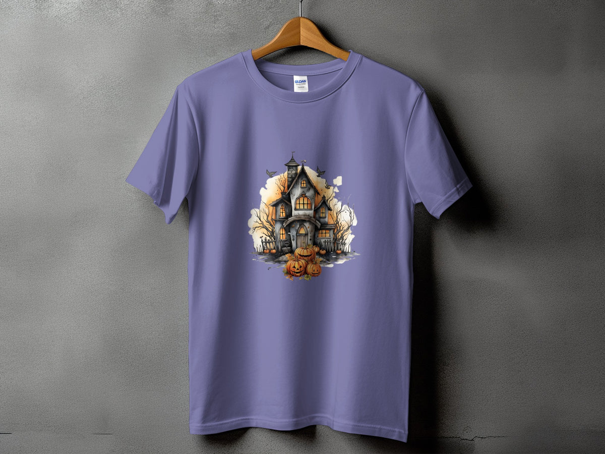 Purple t-shirt featuring a watercolor print of a haunted house and pumpkins.