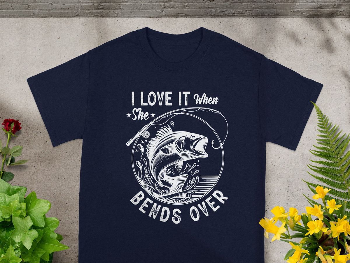 Navy t-shirt with white graphic "I LOVE IT when She BENDS OVER" and a fish.