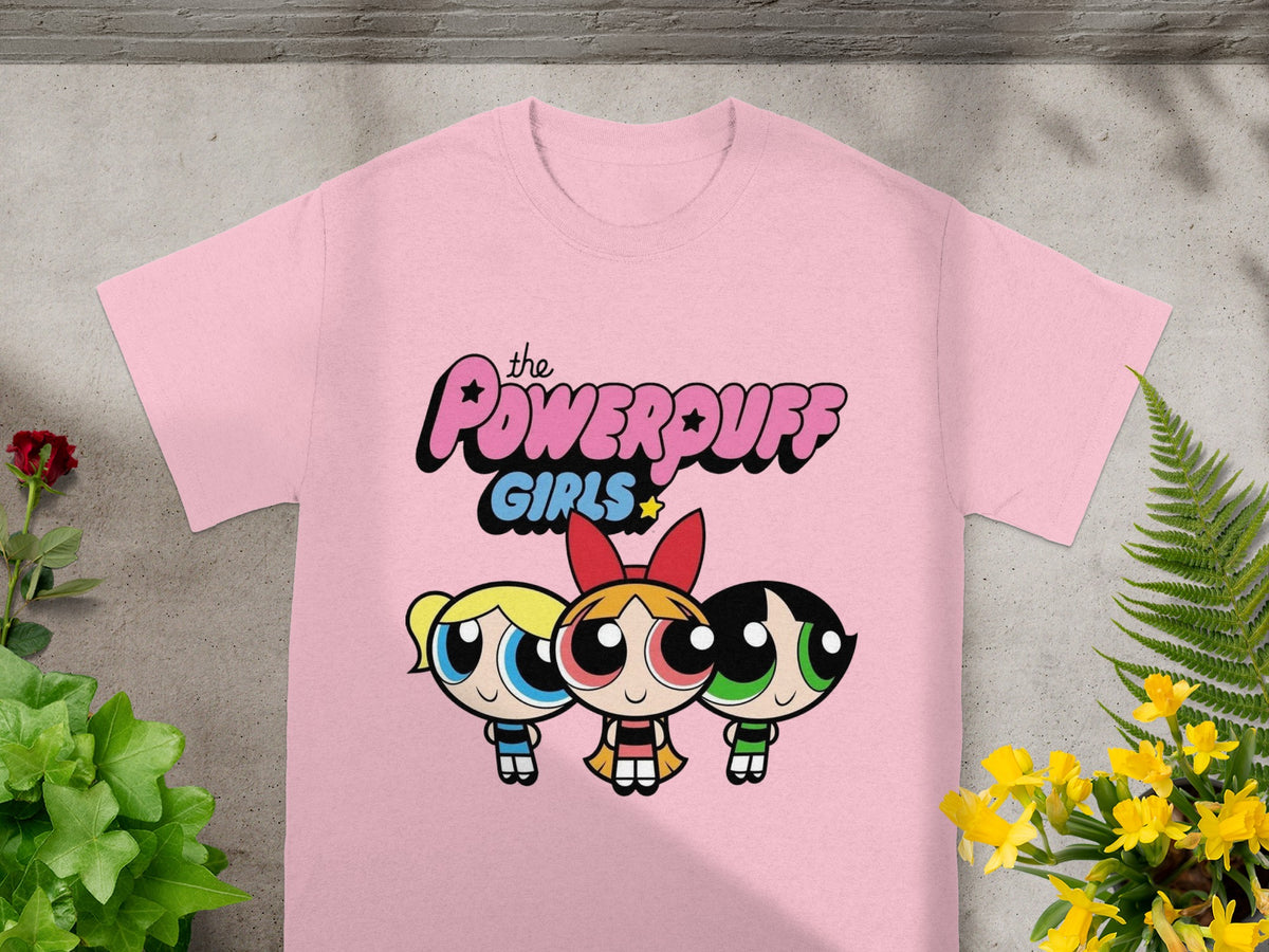 Pink t-shirt with The Powerpuff Girls characters Bubbles, Blossom, and Buttercup.