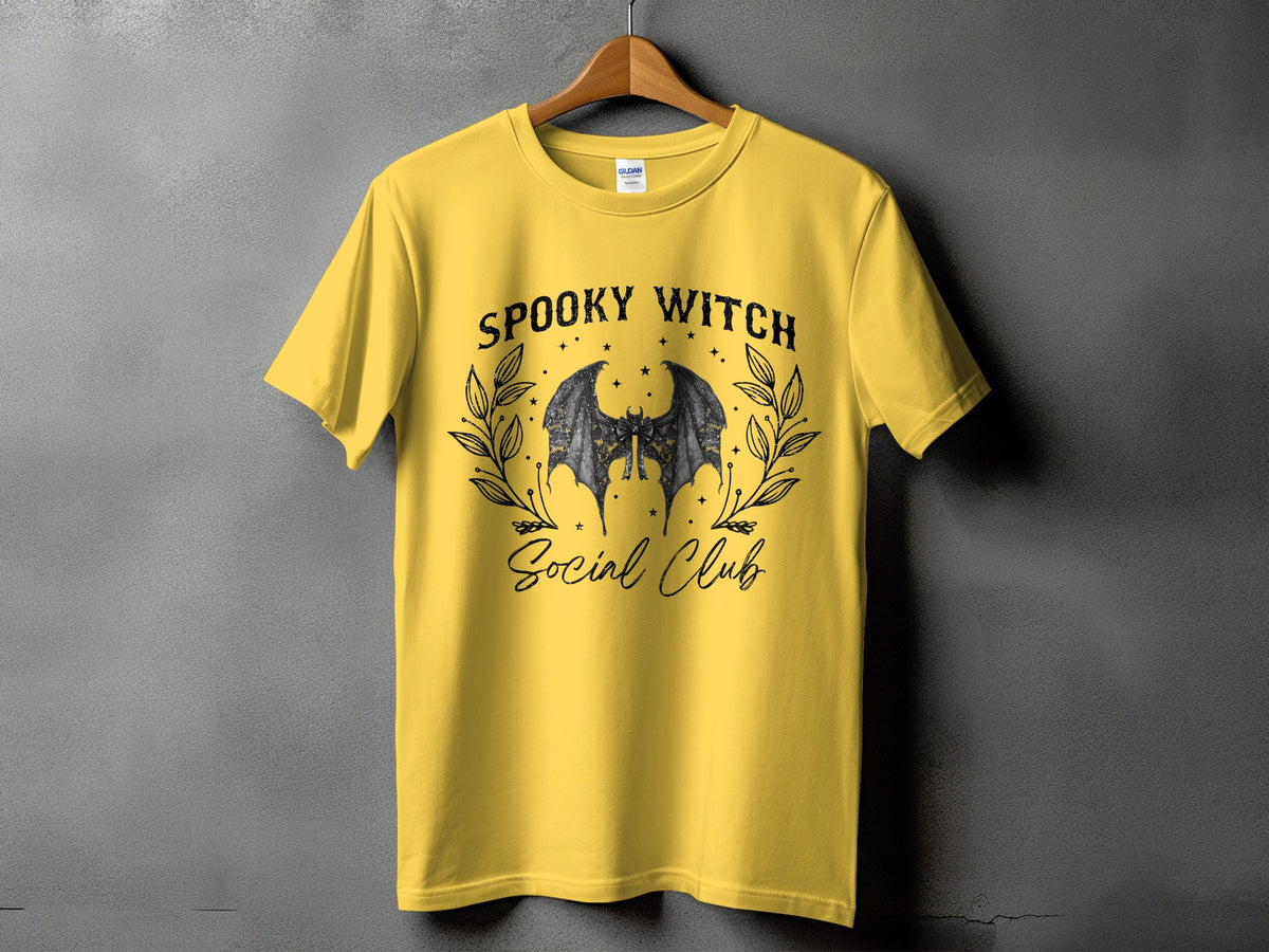 Yellow t-shirt with "Spooky Witch Social Club" text and bat graphic.