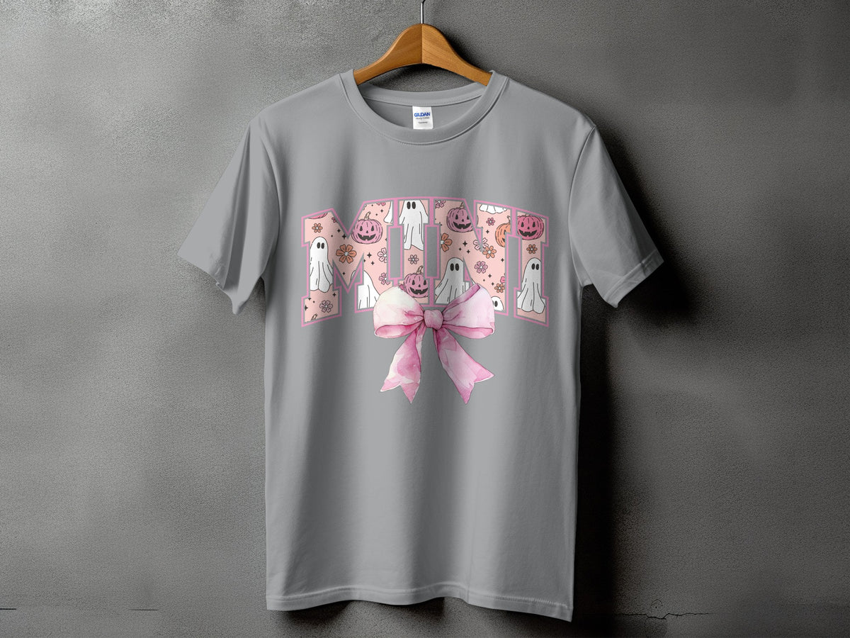 Grey t-shirt with "MOM" text featuring Halloween ghosts and pumpkins, and a pink bow.