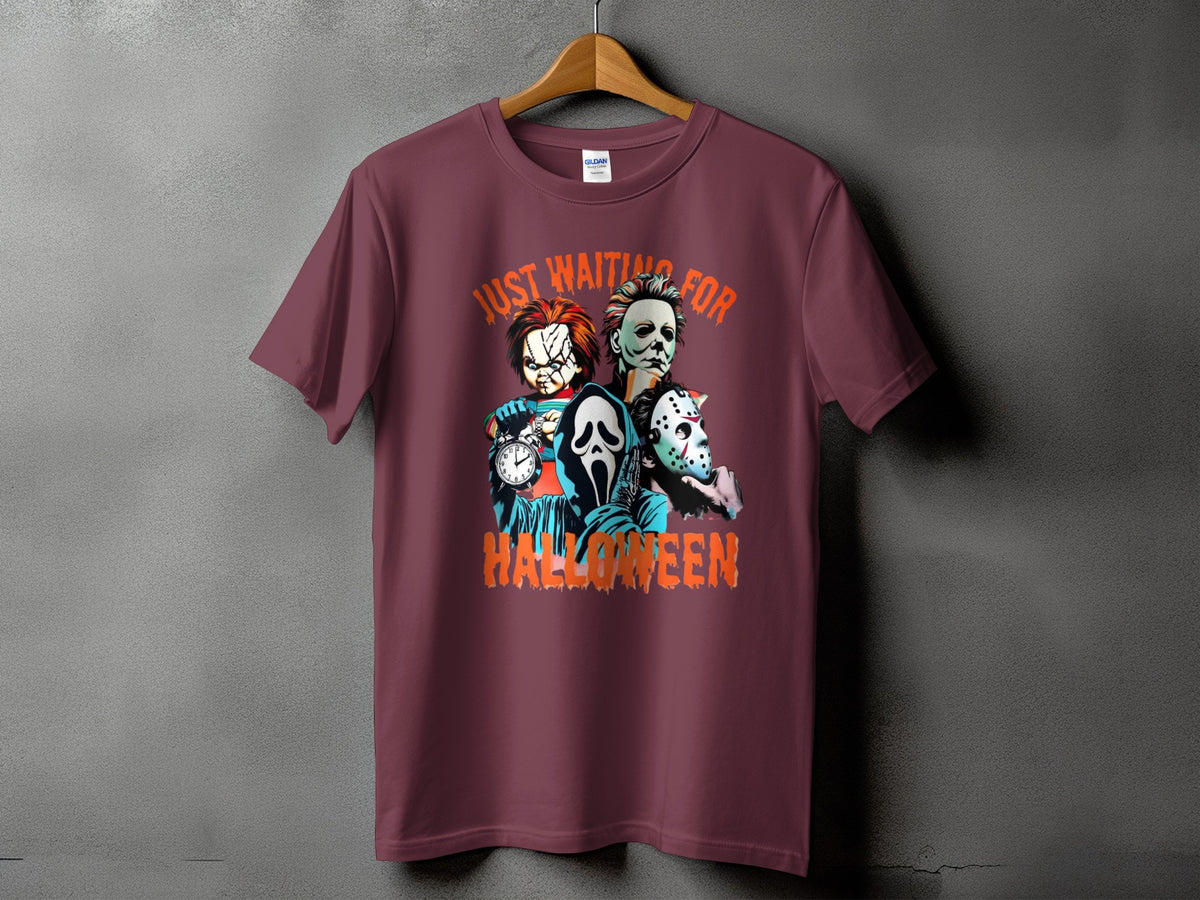 Maroon t-shirt with Chucky, Michael Myers, and Ghostface characters and "Just Waiting For Halloween".