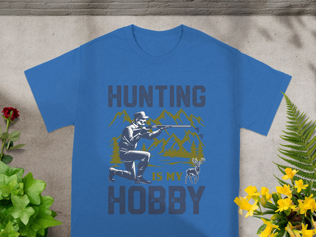 Blue t-shirt with "HUNTING IS MY HOBBY" text and hunting scene graphic.
