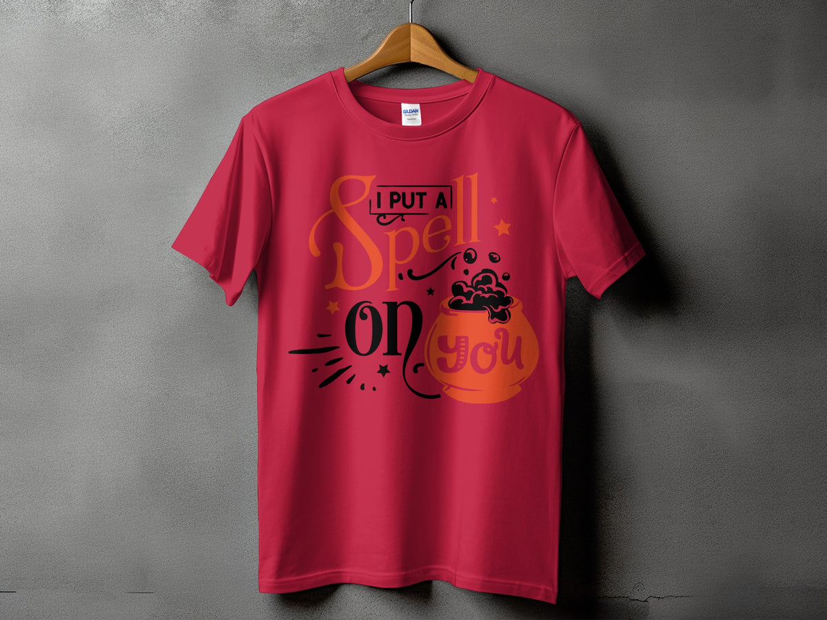 Red t-shirt with text "I PUT A Spell on you" and a cauldron graphic.