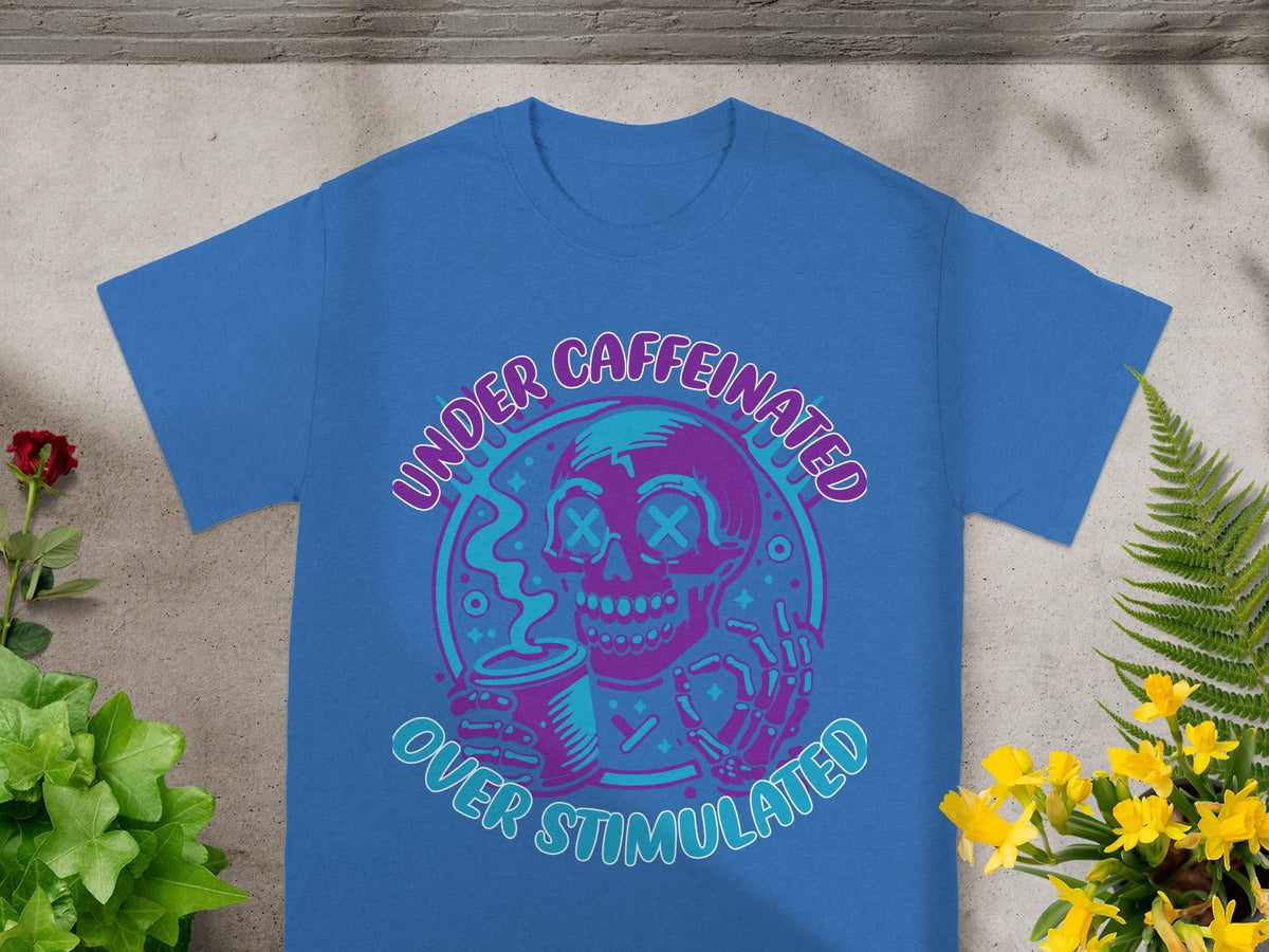 Blue t-shirt with "Under Caffeinated Over Stimulated" text and skull graphic.