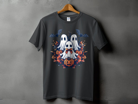 Three ghosts, bats, pumpkins, and orange flowers on a dark t-shirt.