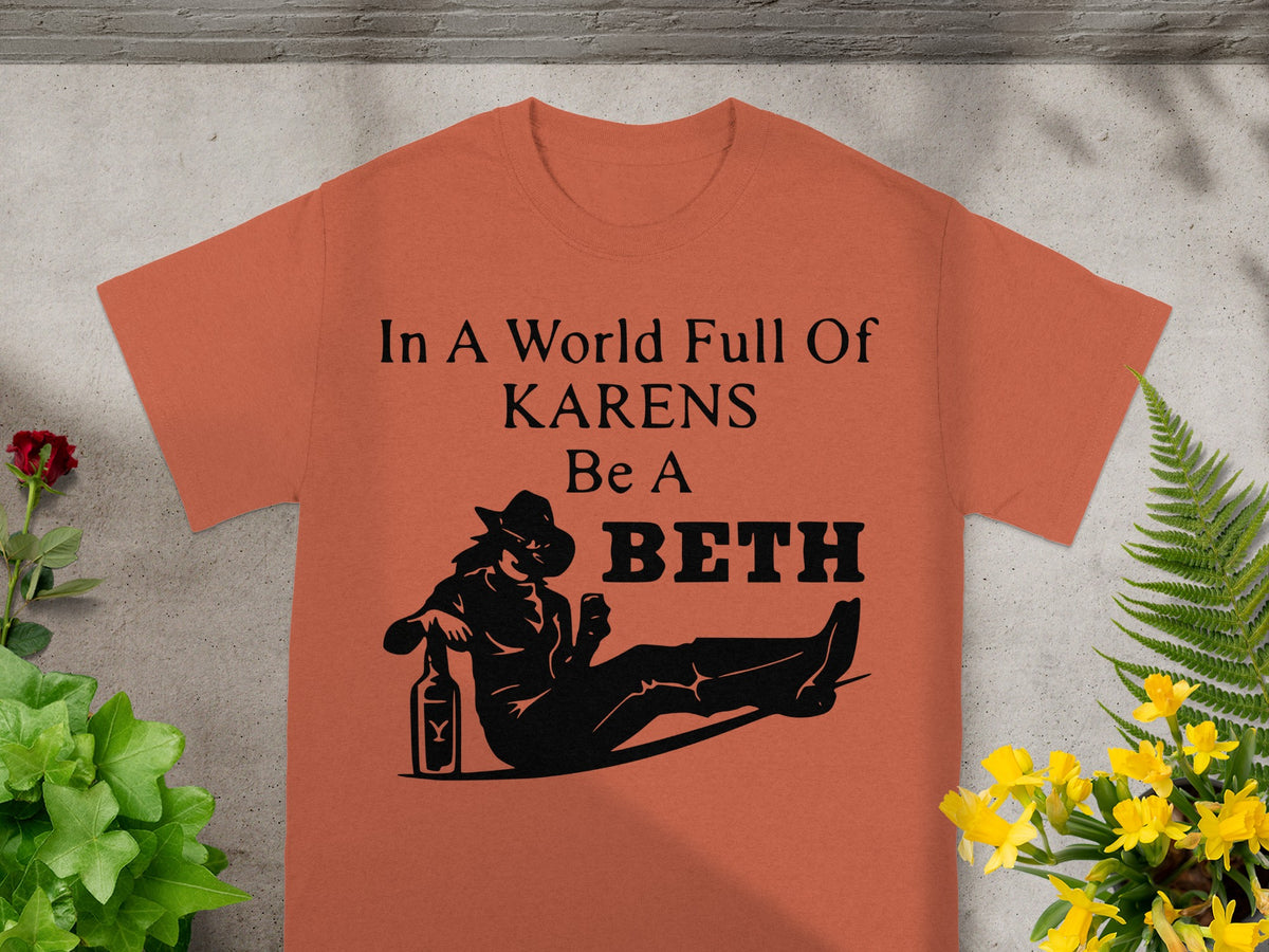 Orange t-shirt with the text "In A World Full Of KARENS Be A BETH" and a silhouette.