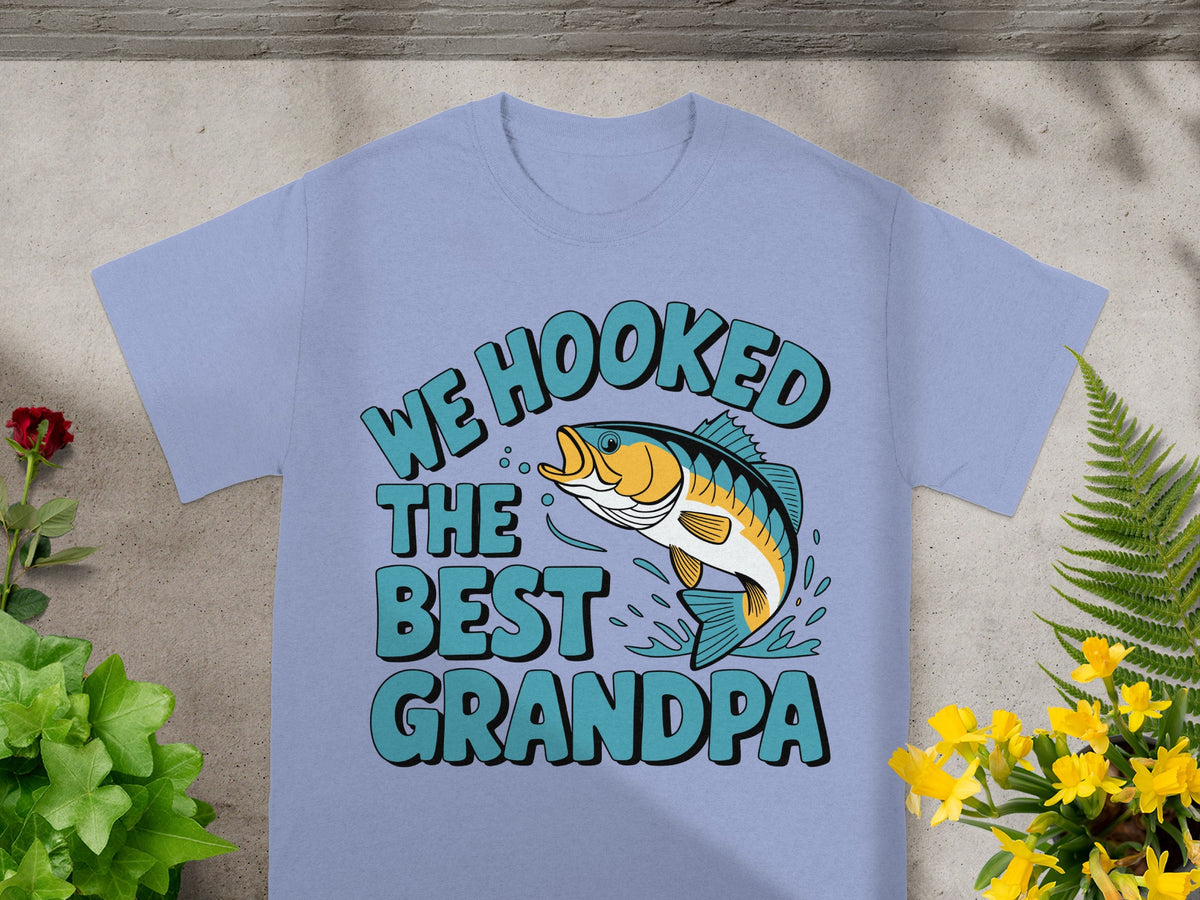 Light blue t-shirt with text "We Hooked The Best Grandpa" and a jumping fish.