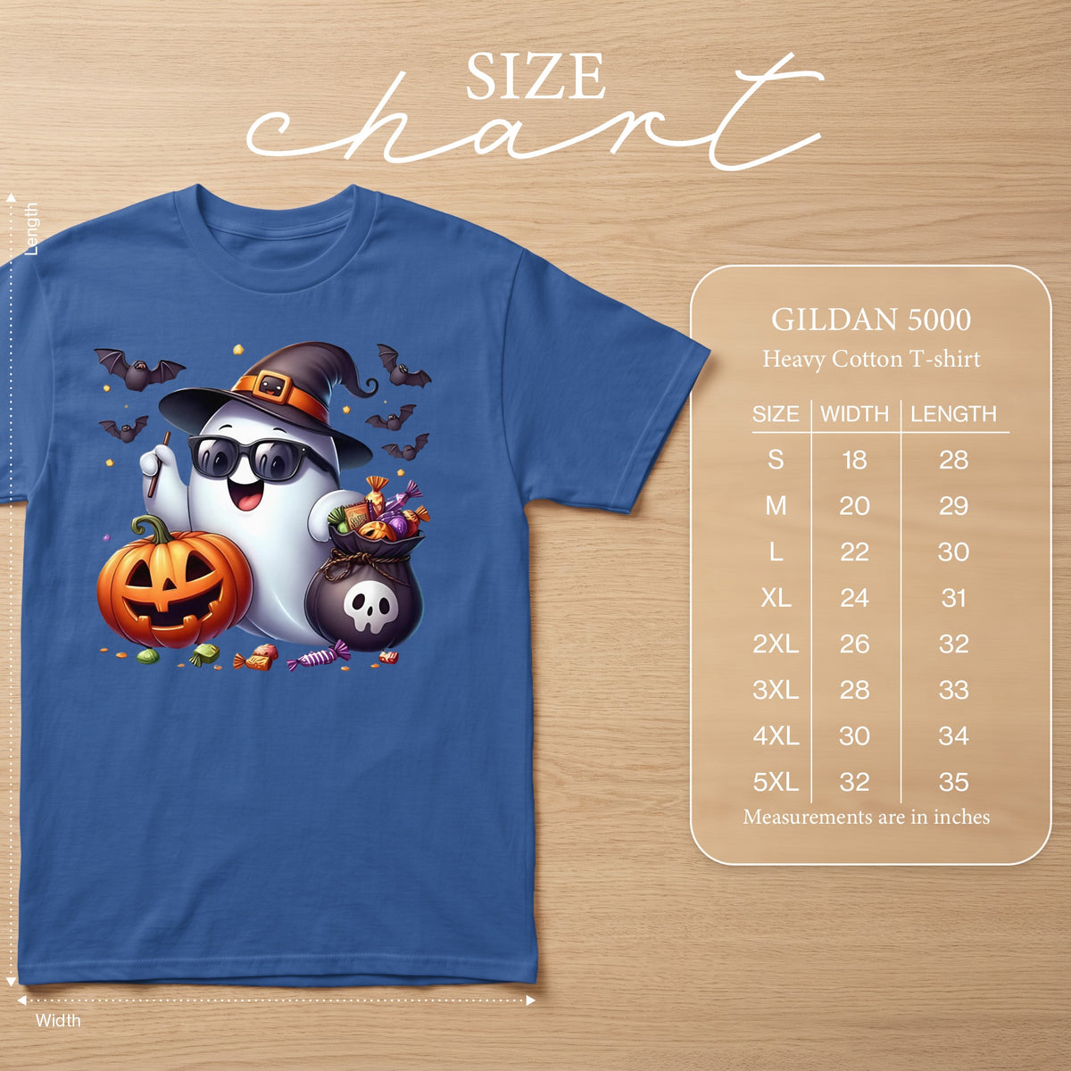 Blue t-shirt with cartoon ghost wearing witch hat, sunglasses, holding pumpkin and candy bag.