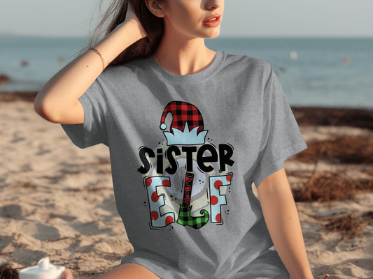 'Sister Elf Graphic Tee for Festive Holiday Season'