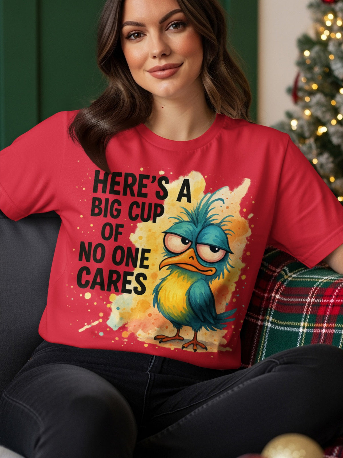 T-shirt with cartoon bird saying "Here's a big cup of no one cares".
