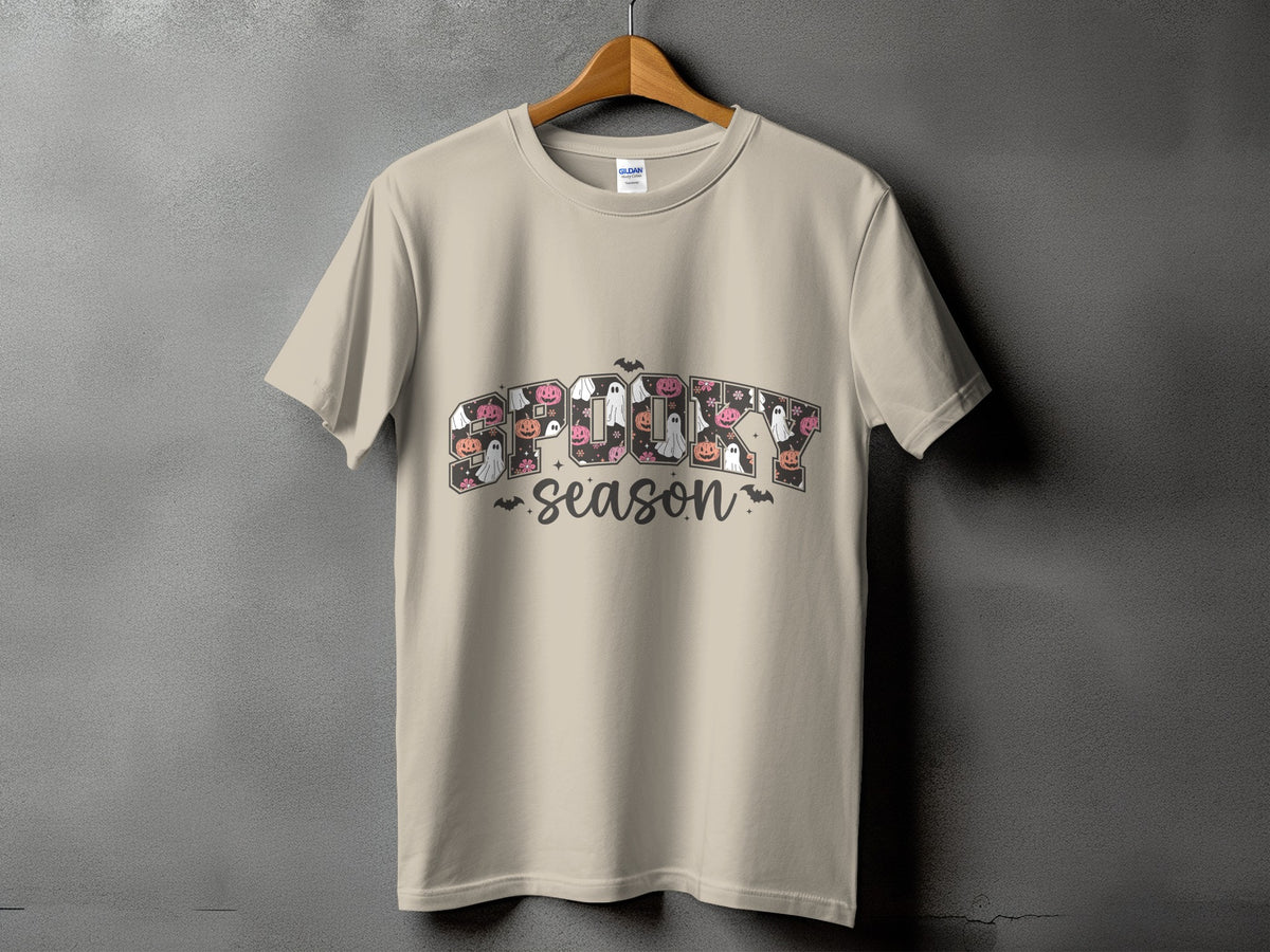 Light beige t-shirt with "SPOOKY SEASON" text and Halloween-themed graphics.