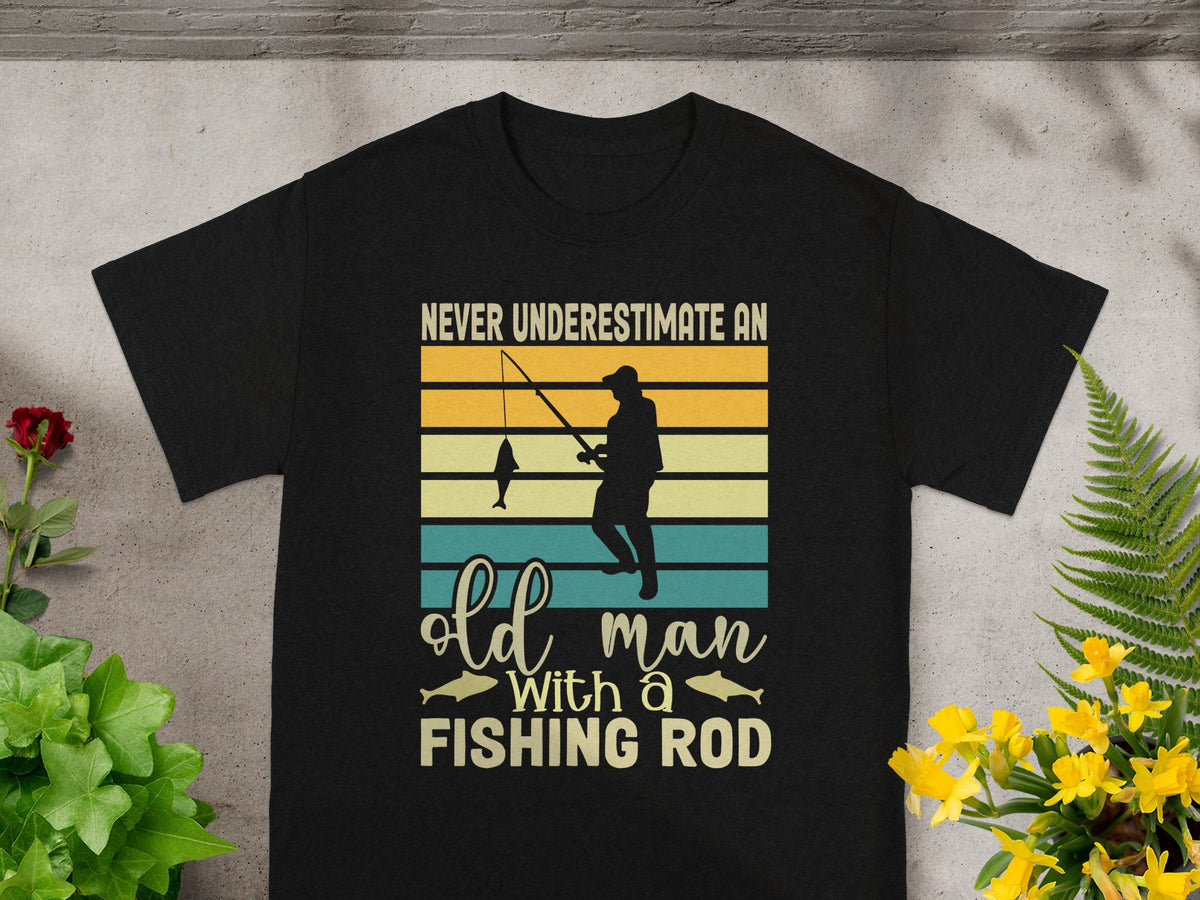 Black t-shirt with "Never underestimate an old man with a fishing rod" text.