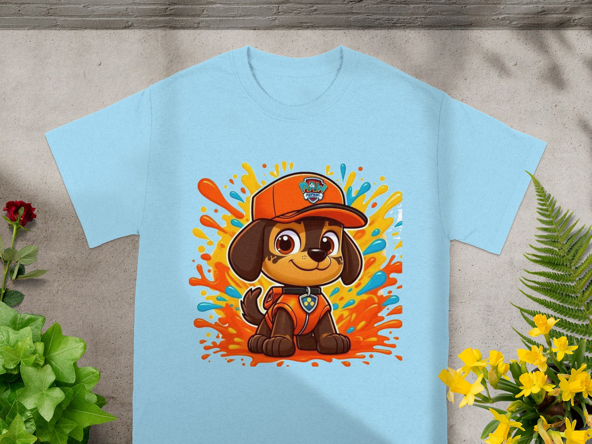 Paw Patrol character Chase on a light blue t-shirt with colorful paint splatters.