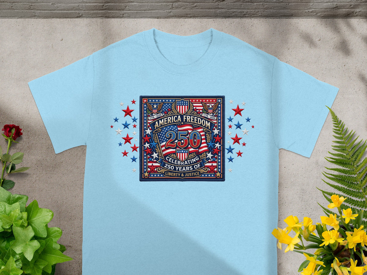 Light blue t-shirt with "America Freedom 250" emblem celebrating 250 years of liberty and justice.