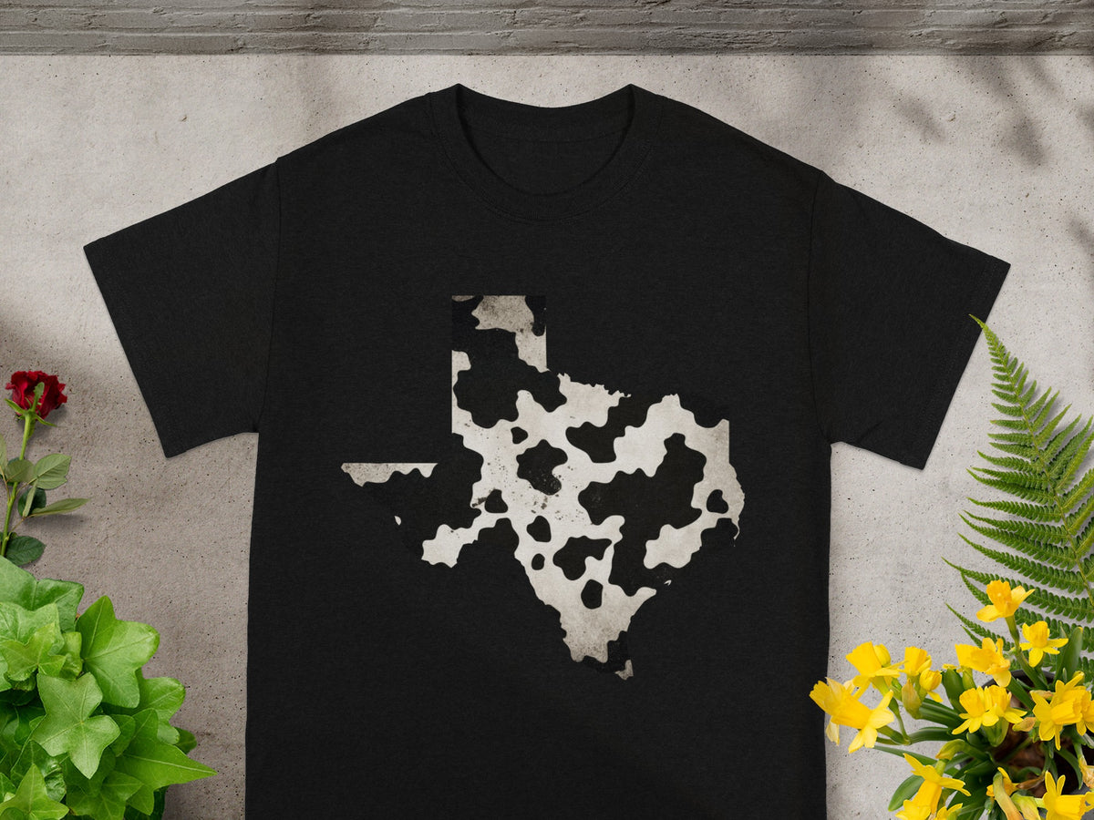 Black t-shirt with a cow print Texas outline graphic.