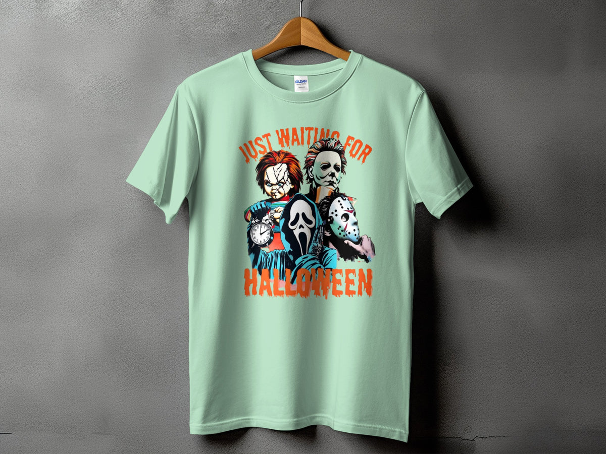Mint green t-shirt with "Just Waiting For Halloween" text and horror movie characters.