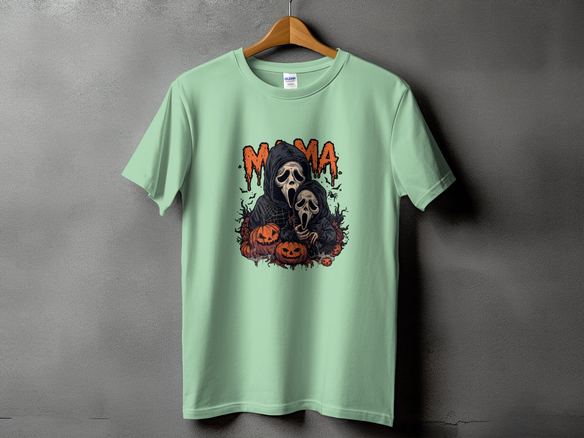 Mint green t-shirt with "Mama" text and spooky ghost and pumpkin graphic.