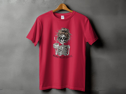Red t-shirt with skeleton graphic holding coffee and text "MAMA NEEDS COFFEE."