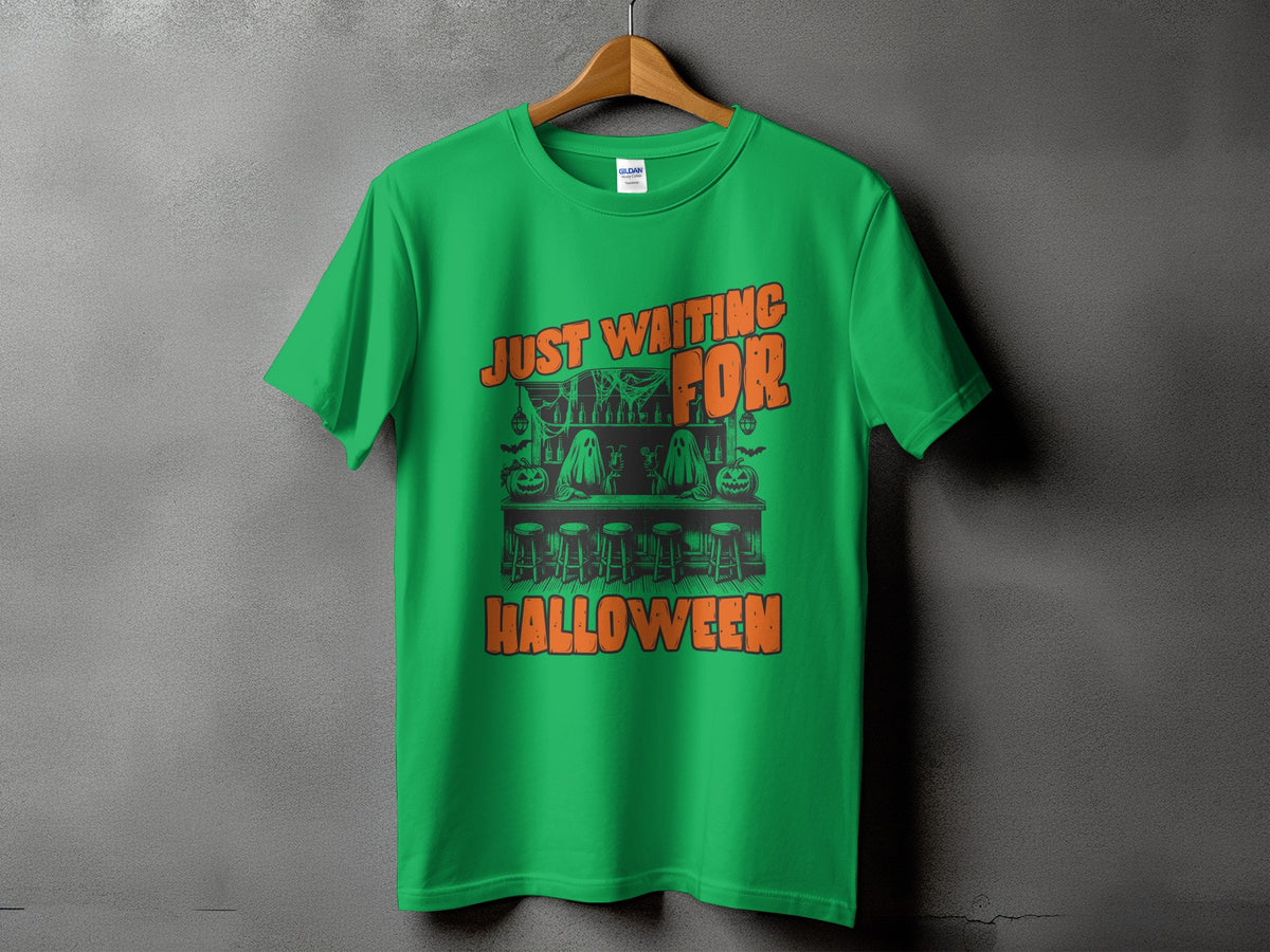 Green t-shirt with "Just Waiting For Halloween" text and Halloween bar graphic.