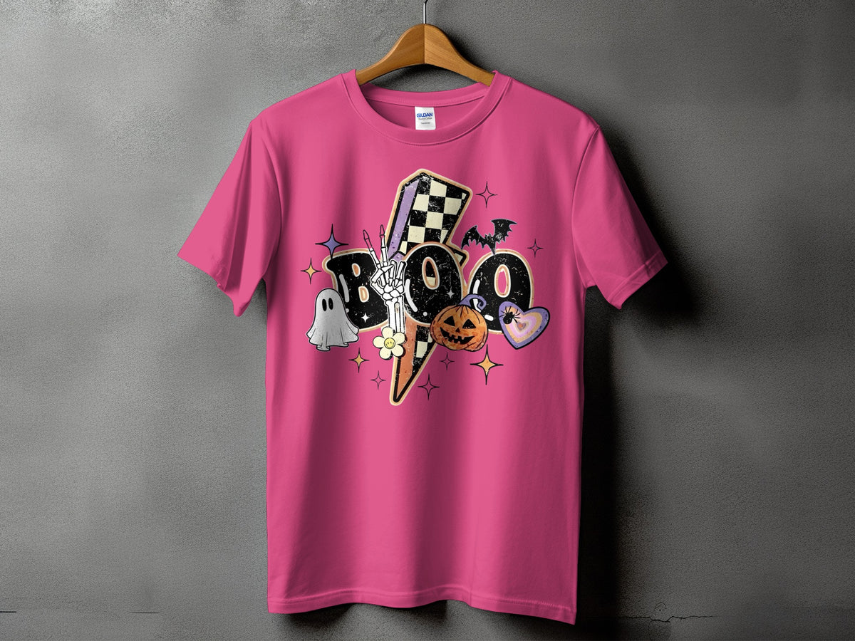 Pink t-shirt with "BOO" Halloween graphic featuring ghost, skeleton hand, pumpkin, and bat.