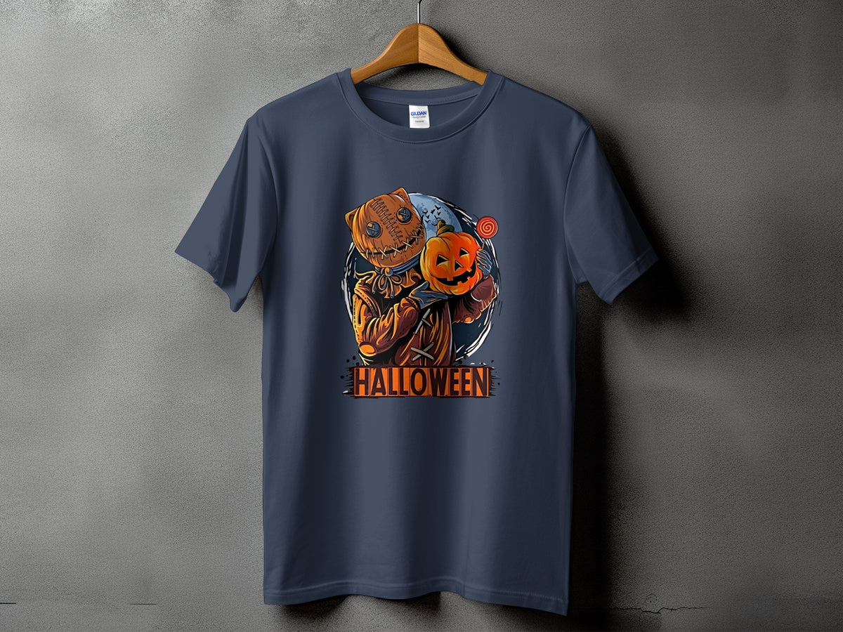 Dark t-shirt with stitched burlap scarecrow holding a pumpkin and lollipop, text reads Halloween.