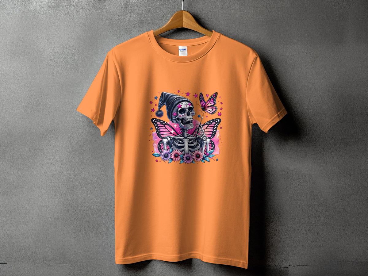 Orange t-shirt with skeleton, butterflies, flowers, and stars graphic.
