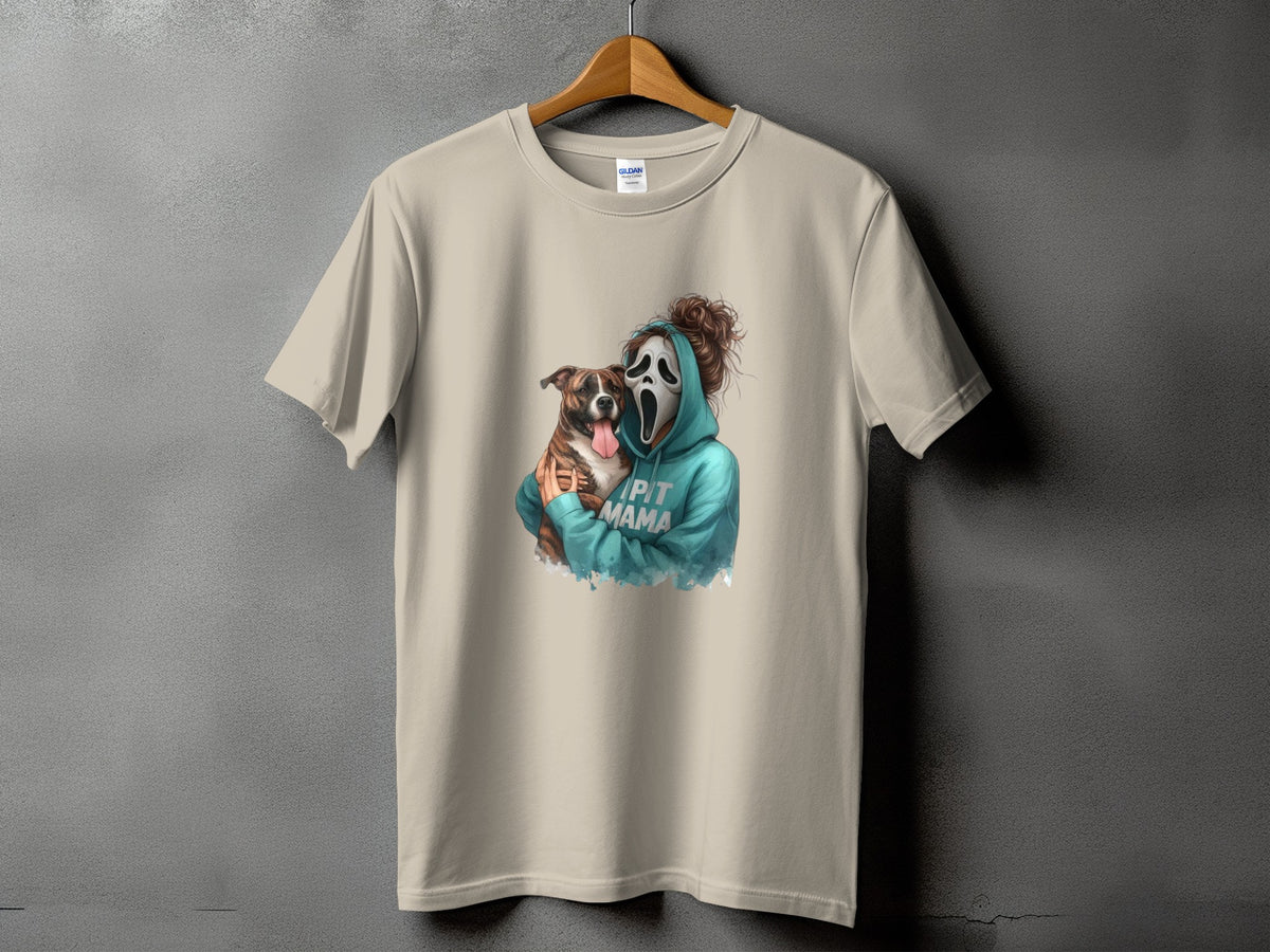Light tan t-shirt with graphic of person in ghost mask holding dog, text reads "PIT MAMA".