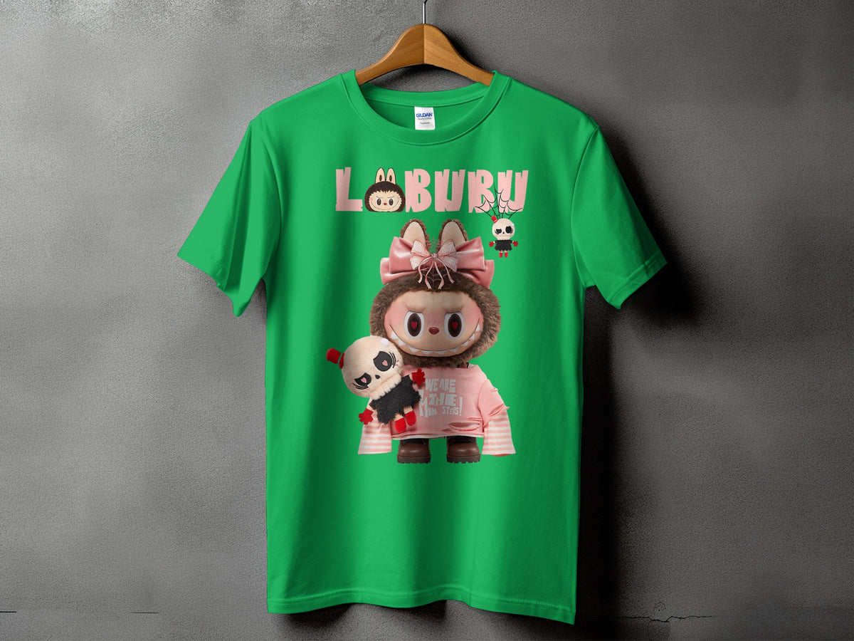 Green t-shirt with cartoon "LABURU" text, character with pink bow, and panda plush.