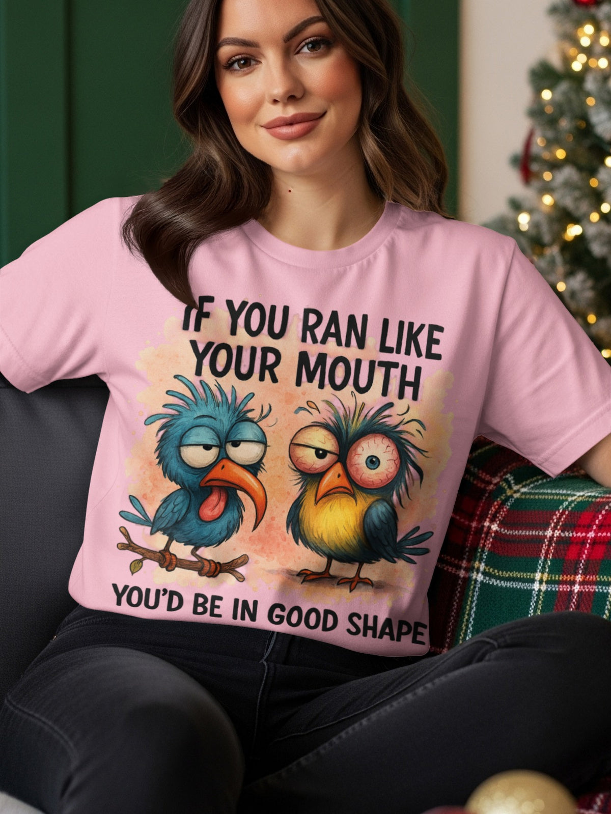 Pink t-shirt with cartoon birds and the text "If you ran like your mouth you'd be in good shape".