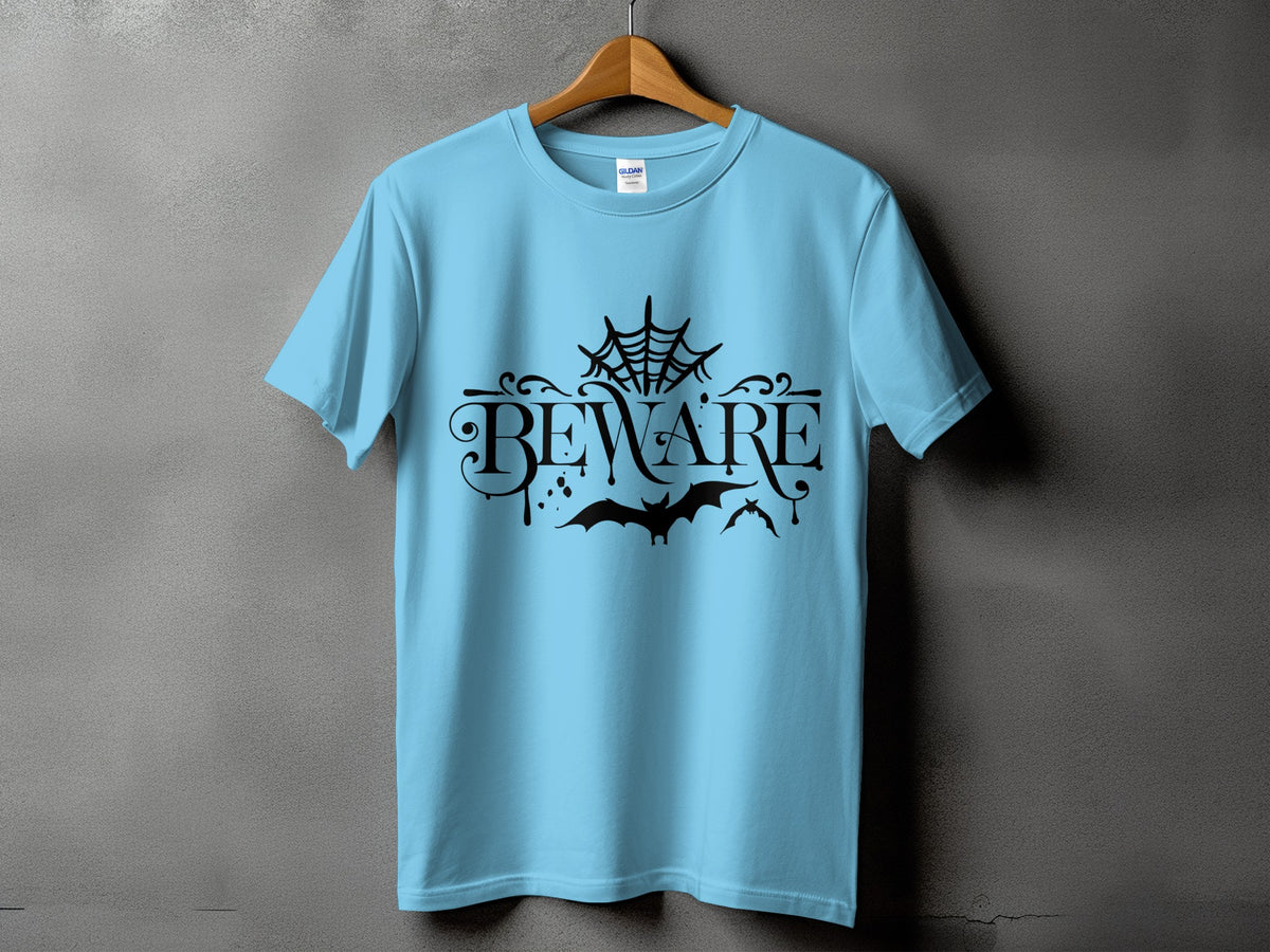 Light blue t-shirt with black "BEWARE" text, bats, and spider web graphic.