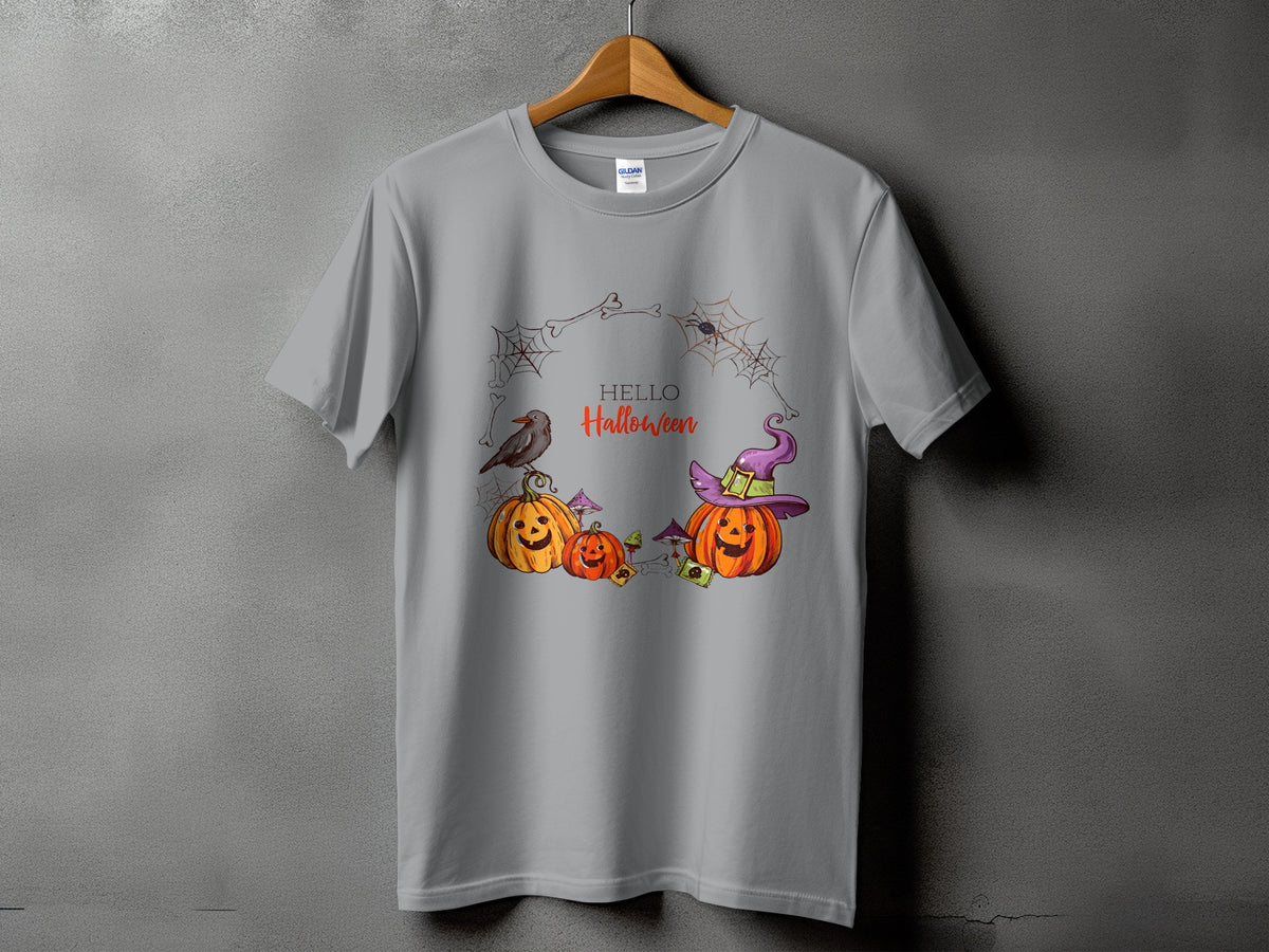 Grey t-shirt with a Halloween graphic featuring pumpkins, a crow, and a spiderweb wreath.