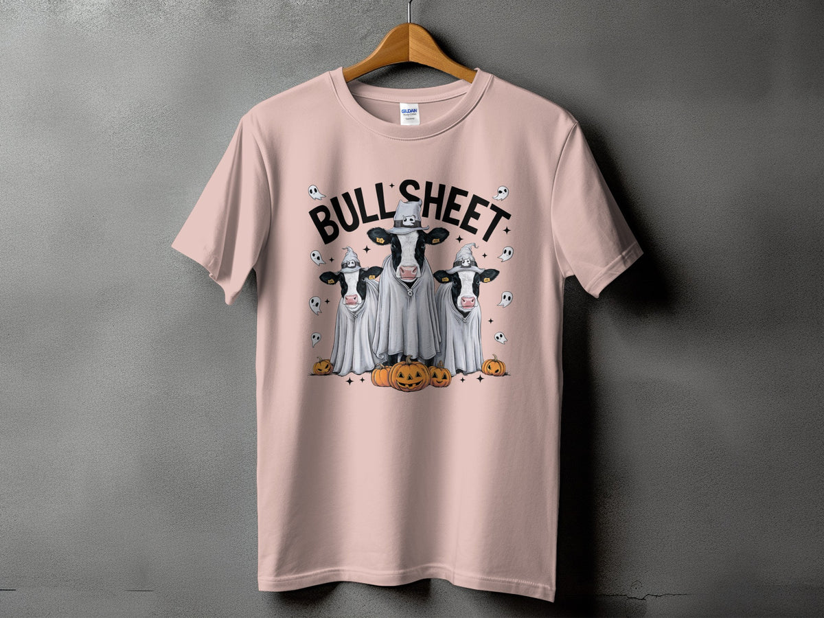 Pink t-shirt with three cows in ghost costumes and pumpkins.