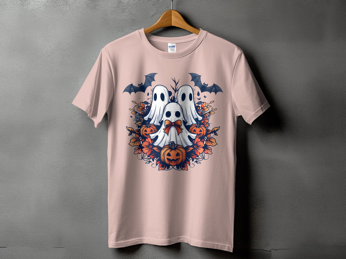 Pink t-shirt with Halloween design of three ghosts, pumpkins, bats, and foliage.