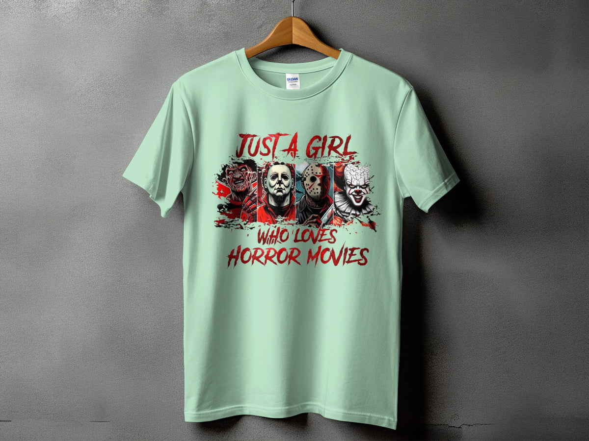 Light green t-shirt with horror movie characters and "Just A Girl Who Loves Horror Movies" text.