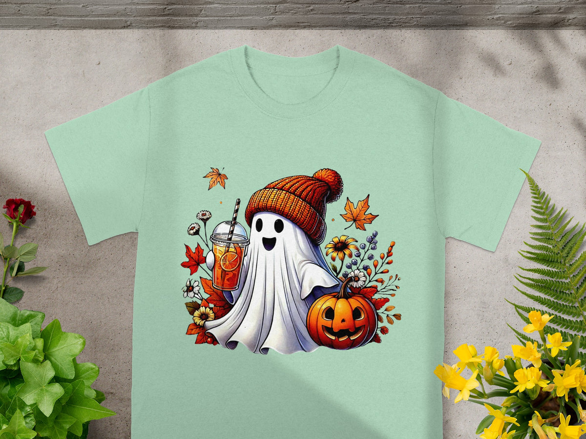 Ghost with a drink, pumpkin, and autumn leaves on a mint t-shirt.