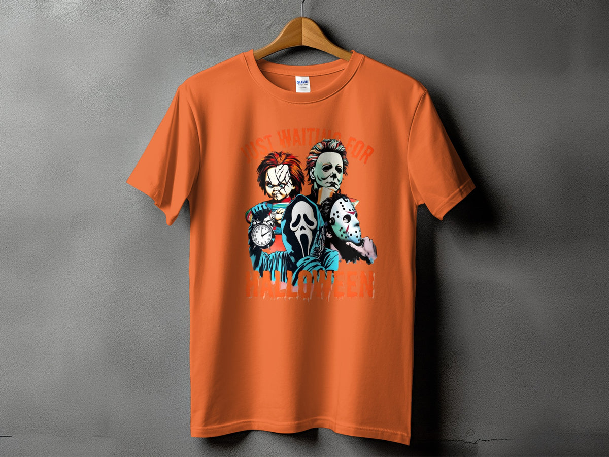 Orange t-shirt with "Just Waiting For Halloween" and horror characters.