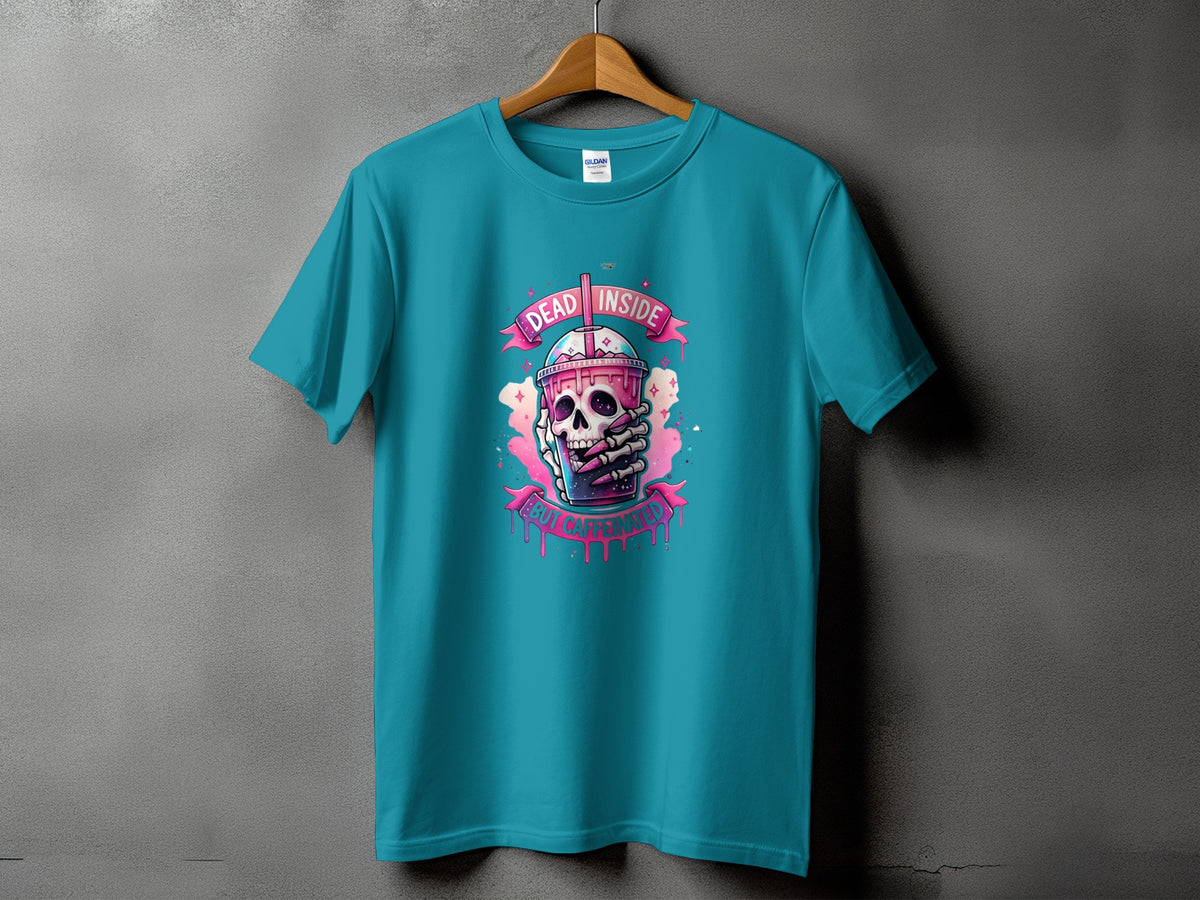 Teal t-shirt with a graphic of a skeleton holding a pink drink with "DEAD INSIDE" and "BUT CAFFEINATED".